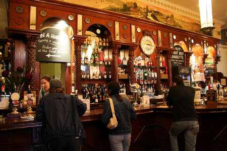 London, UK - June 03, 2006: Inside view of a public house, known as pub, for drinking and socializing, is the focal point of the community, Pub business has been declining every year.のeditorial素材