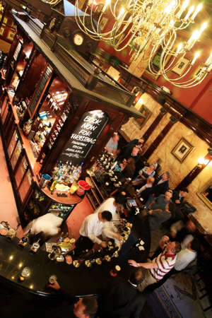 London, UK - September 17, 2010: Inside view of a public house, known as pub, for drinking and socializing, is the focal point of the community, Pub business has been declining every year.のeditorial素材
