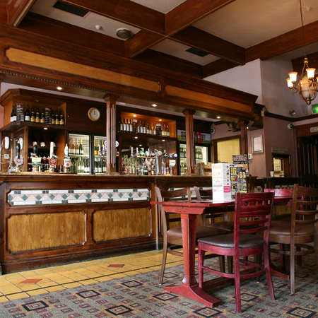 London, UK - September 02, 2010: Inside view of a public house, known as pub, for drinking and socializing, is the focal point of the community, Pub business has been declining every year.のeditorial素材