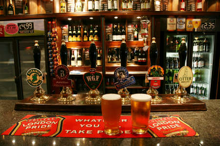 London, UK - September 06, 2010: Inside view of a public house, known as pub, for drinking and socializing, is the focal point of the community, Pub business has been declining every year.のeditorial素材