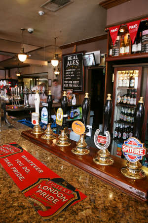 London, UK - September 02, 2010:  Inside view of a public house, known as pub, for drinking and socializing, is the focal point of the community, Pub business has been declining every year.のeditorial素材