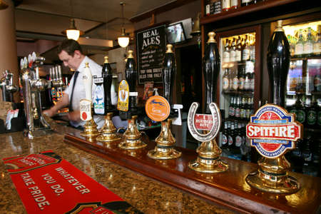 London, UK - September 02, 2010: Inside view of a public house, known as pub, for drinking and socializing, is the focal point of the community, Pub business has been declining every year.のeditorial素材