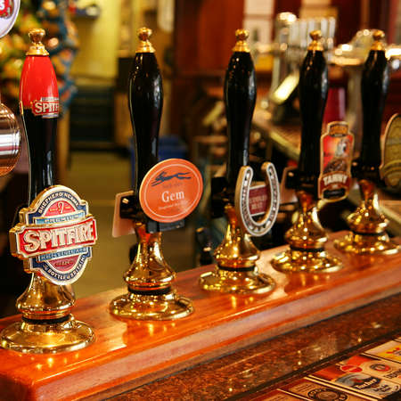 London, UK - August 26, 2010: Inside view of a public house, known as pub, for drinking and socializing, is the focal point of the community, Pub business has been declining every year.のeditorial素材