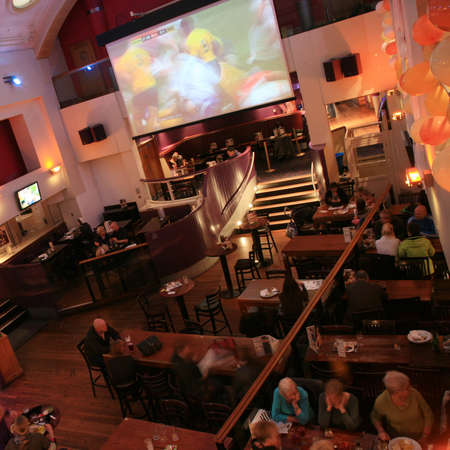 London, UK - November 06, 2010: Inside view of a public house, known as pub, for drinking and socializing, is the focal point of the community, Pub business has been declining every year.のeditorial素材