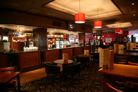 London, UK - June 03, 2011: Inside view of a public house, known as pub, for drinking and socializing, is the focal point of the community, Pub business has been declining every year.のeditorial素材