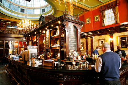 London, UK - July 30, 2012: Inside view of a public house, known as pub, for drinking and socializing, is the focal point of the community, Pub business has been declining every year.のeditorial素材