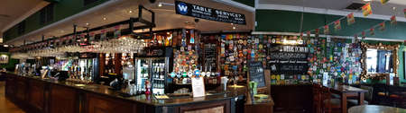 LONDON - AUG 24: Interior of pub, for drinking and socializing, focal point of the community, on Aug 24, 2019, London, UK. Pub business, now about 53,500 pubs in UK, has been declining every year.のeditorial素材