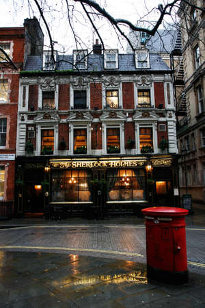 London, UK - July 14, 2014: Outside view of pub, for drinking and socializing, focal point of community. Pub business, now about 53,500 pubs in the UK, has been declining every year.のeditorial素材