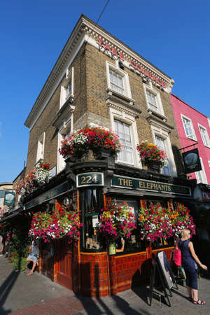 London, UK - August 22, 2015: Outside view of pub, for drinking and socializing, focal point of community. Pub business, now about 53,500 pubs in the UK, has been declining every year.のeditorial素材