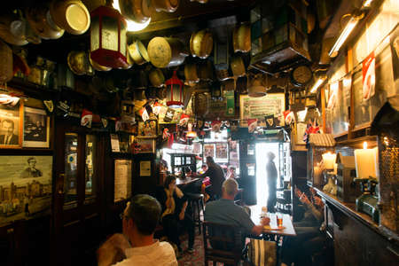 London, UK - May 7, 2016: Inside view of pub, for drinking and socializing, focal point of community. Pub business, now about 53,500 pubs in the UK, has been declining every year.のeditorial素材