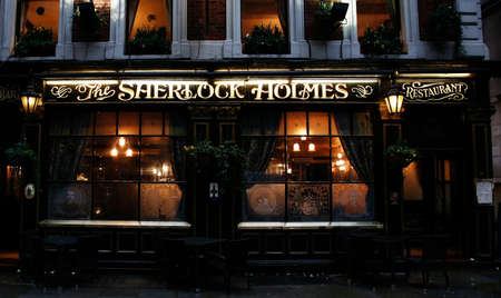 London, UK - July 14, 2014: Outside view of pub, for drinking and socializing, focal point of community. Pub business, now about 53,500 pubs in the UK, has been declining every year.のeditorial素材