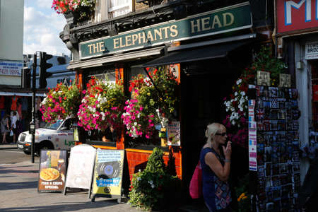 London, UK - August 22, 2015: Outside view of pub, for drinking and socializing, focal point of community. Pub business, now about 53,500 pubs in the UK, has been declining every year.のeditorial素材