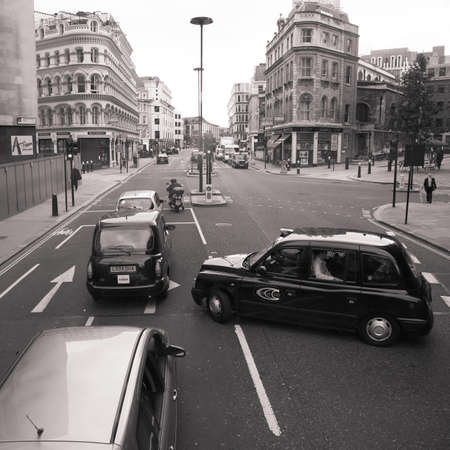 Lonodn, UK - August 19, 2010 : Taxi in the street of London on May 8, 2010 in London, UK. Cabs, Taxis, are the most iconic symbol of London as well as London's Red Double Decker Bus.のeditorial素材