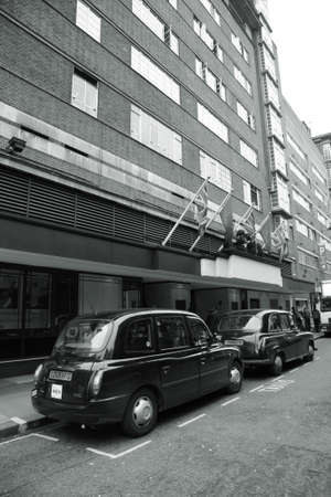 London, UK - August 12, 2010: Taxi in the street of London. Cabs are the most iconic symbol of London as well as London's Red Double Decker Bus.のeditorial素材