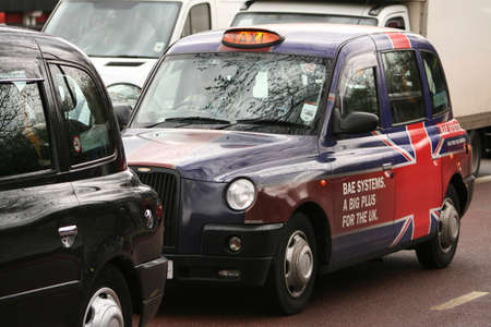 LONDON - APRIL 1: London Taxi, also called hackney carriage, black cab, on April 1, 2010 in London, UK. Traditionally Taxi cabs are all black in London but now produced in various colors.のeditorial素材