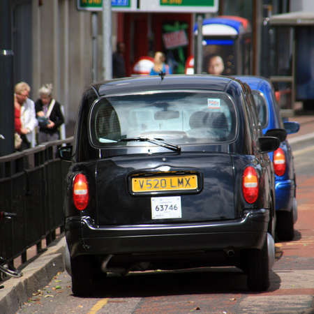 Lonodn, UK - July 15, 2010 : Taxi in the street of London on May 8, 2010 in London, UK. Cabs, Taxis, are the most iconic symbol of London as well as London's Red Double Decker Bus.のeditorial素材
