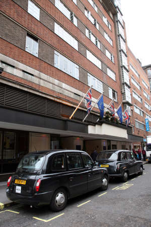 Lonodn, UK - August 12, 2010 : Taxi in the street of London on May 8, 2010 in London, UK. Cabs, Taxis, are the most iconic symbol of London as well as London's Red Double Decker Bus.のeditorial素材