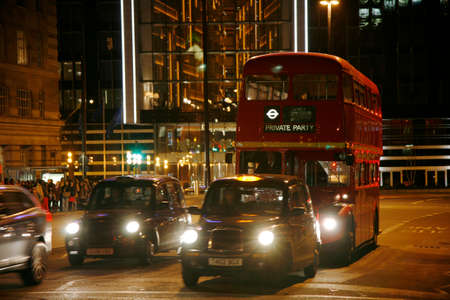London, UK - November 30, 2011 : Taxi in the street of London. UK. Cabs, Taxis, are the most iconic symbol of London as well as London's Red Double Decker Bus.のeditorial素材