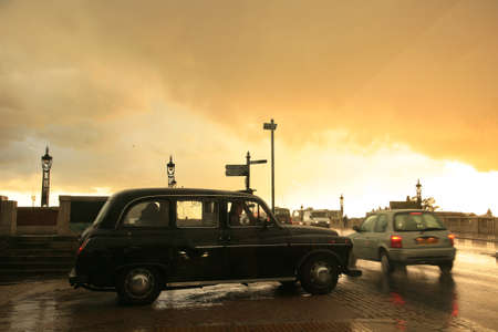 London, UK - April 01, 2010: Taxi in the street of London. Cabs are the most iconic symbol of London as well as London's Red Double Decker Bus.のeditorial素材