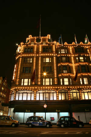 London, UK - January 11, 2011 : Night View of Harrods department store in the Brompton Road, near Knightsbridge Tube Station. This department store was opened at 1824 and now it is one of the most famous luxury store in London.のeditorial素材