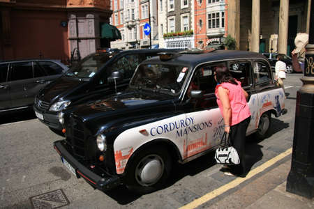LONDON - JULY 3: FX4 Hackney Carriage, also called London Taxi or Black Cab, at Strand on July 3, 2010 in London, UK. TX4 is manufactured by the London Taxis International, LTI.のeditorial素材