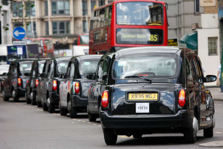 London, UK - June 13, 2012: London Taxi, also called hackney carriage, black cab. Traditionally Taxi cabs are all black in London but now produced in various colors.のeditorial素材