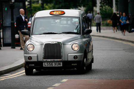 London, UK - June 14, 2012: London Taxi, also called hackney carriage, black cab. Traditionally Taxi cabs are all black in London but now produced in various colors.のeditorial素材