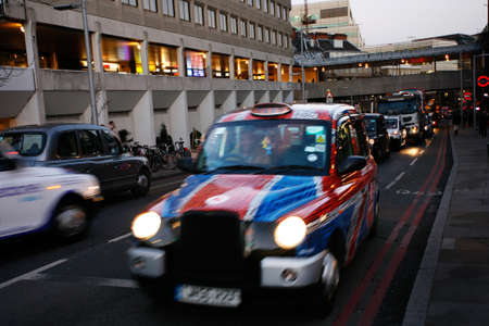 London, UK - Dec 17, 2012: London Taxi, also called hackney carriage, black cab. Traditionally Taxi cabs are all black in London but now produced in various colors.のeditorial素材