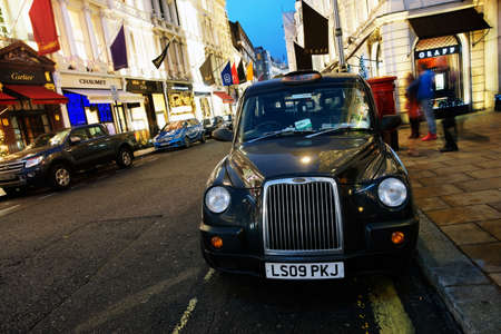 London, UK - Dec 8, 2016: London Taxi, also called hackney carriage, black cab. Traditionally Taxi cabs are all black in London but now produced in various colors.のeditorial素材