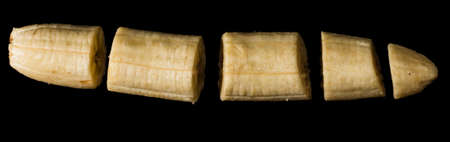 Banana levitated on solid black backgroundの写真素材