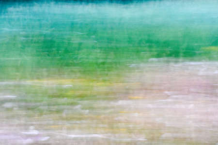 green and sand colored grunge paper backgroundの写真素材