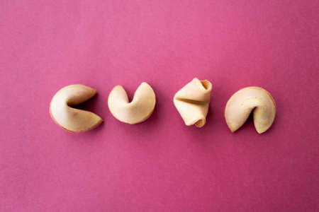 The fortune cookies on red background. Flat lay styleの写真素材