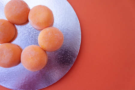 Mochi with mango. Premium ice-cream wrapped in sweet rice dough, traditional japonese desert. Gluten...