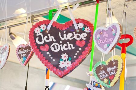 Gingerbread heart in german tradition christmas market. Text translation "I love you"の写真素材