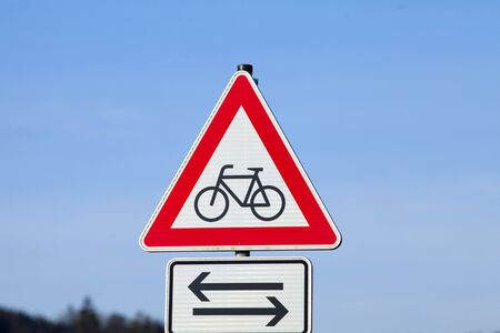Attention sign bicycle cross road. Sign on raod warning car driversの写真素材