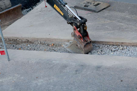 Road construction with excavator. street buildingの写真素材