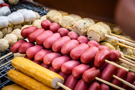 Stall selling street food at Phuket Naka Market. The immense nigh bazaar is only available over the...