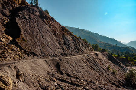 View enroute dangerous landslide prone roads in Himalayas mountain river valley at Uttarakhand,...