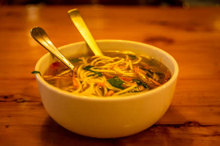 Selective focus of Thukpa, It is a Tibetan noodle soup, which originated in the eastern part of Tibet. Vegetable vegetarian is a famous variant among tourist in Mcleodganj, Himachal Pradesh India.の写真素材