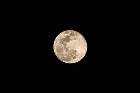 A supermoon is a full moon that nearly coincides with perigee, the closest that the Moon comes to the Earth in its elliptic orbit resulting in a slightly larger-than-usual apparent size of lunar disk.の写真素材