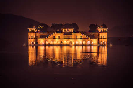 Illuminated night view of Jal Mahal 'Water Palace' is an architectural showcase of Rajput style in the Man Sagar lake in jaipur city, the capital of Rajasthan, India.のeditorial素材