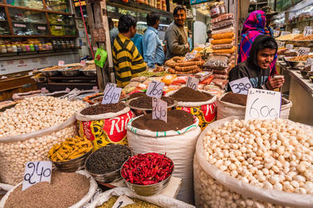 Old Delhi, India-Febuary 2020: Dry Fruits Market at Khari Baoli, It is a street known for its wholesale grocery and Asia's largest wholesale spice market sells spices, nuts, herbs and food products.のeditorial素材