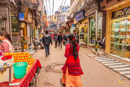 OLD DELHI, INDIA - February 2020: Chaotic traffic in Chandni Chowk market, Street with people and...