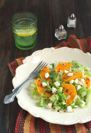 Green salad with pumpkin, feta and almonds の写真素材