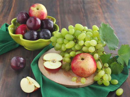 Fresh fruits  apples, plums, grapes の写真素材