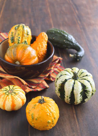 Autumn pumpkins on wooden table の写真素材