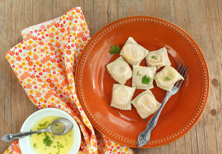 Squash ravioli with butter sauceの写真素材