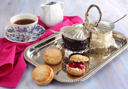 Home-baked scones tea with jam and double creamの写真素材