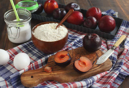 Making a sweet plum tart with almonds の写真素材