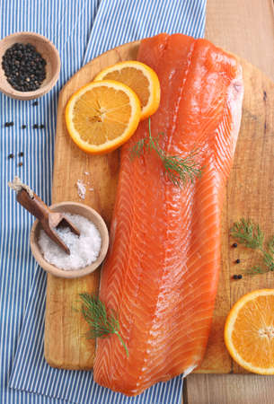 Fresh salmon with dill and orange slices 
